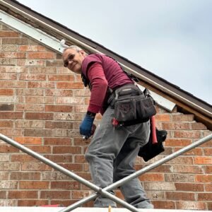 A person working on a roof or a construction site