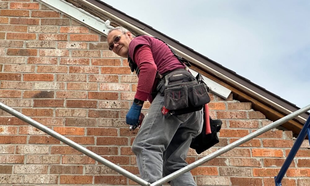 A person working on a roof or a construction site