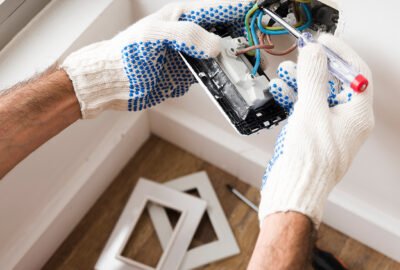 Electrician repairing electrical board Sugar Land